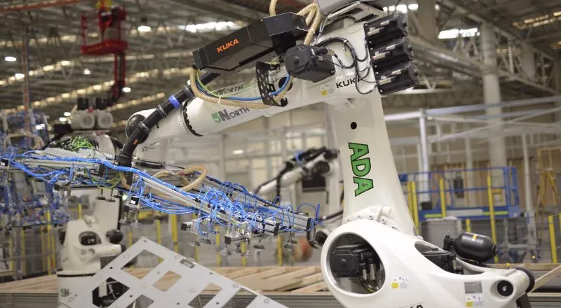 A robotic arm named ADA fabricating a prefabricated wall frame